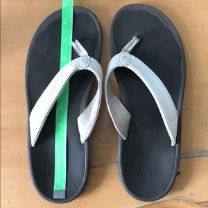 White Olukai sandals